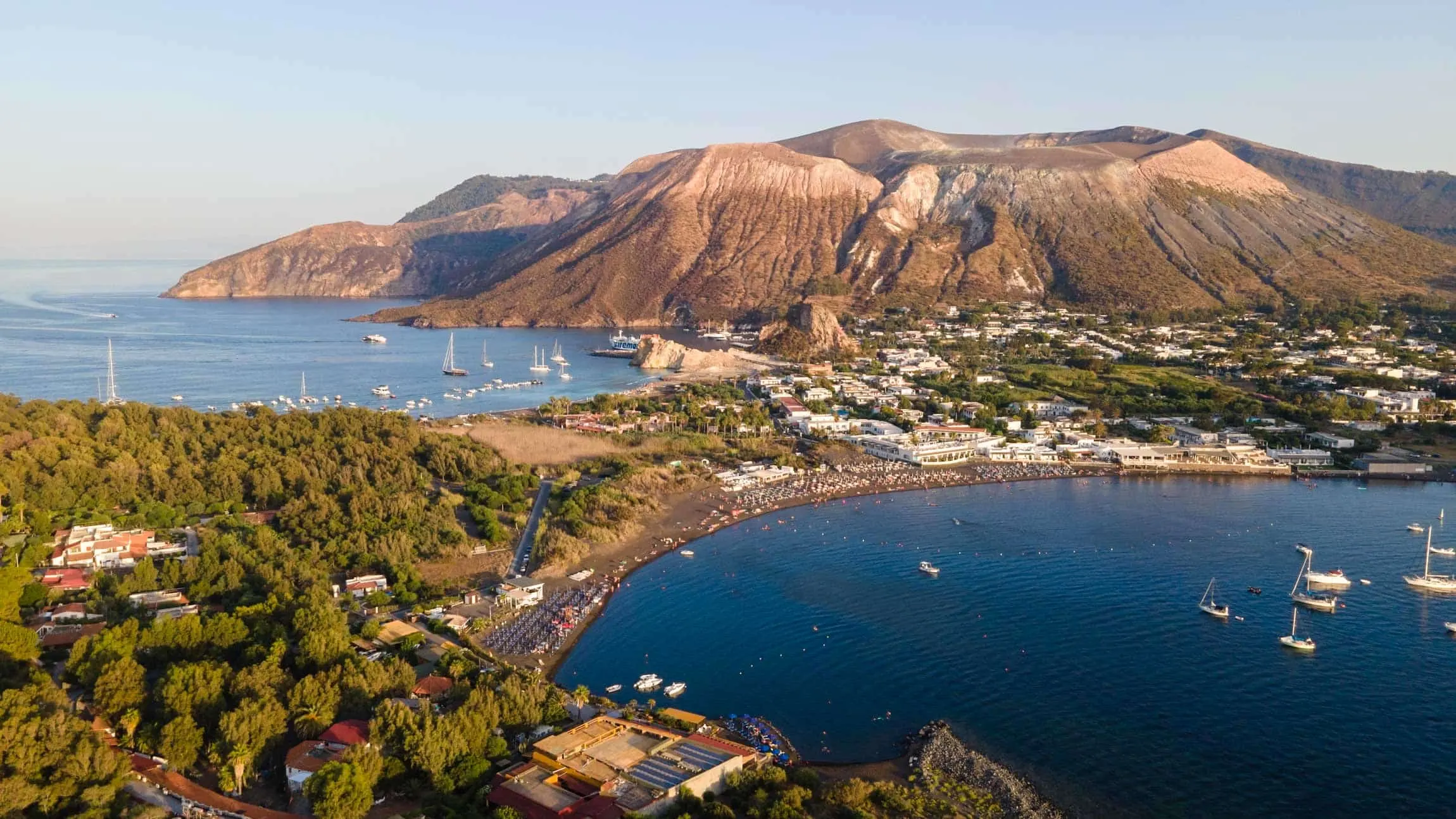 Aerial view of Vulcano Porto with the Gran Cratere behind the bay